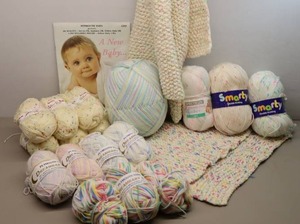 lot 316 image: Baby Blanket Knit Crocheted Project StartedFinished wAdditional Yarn