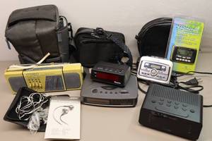 lot 367 image: Small Electronics Alarm Clocks, HH Aiwa Tape Player, Bose Ear Buds, JogMate2, GPX Radio Etc
