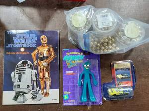 lot 41 image: Stars Wars Book, Gumby Figure, Dale Earnhardt Car, Gold Bead Garland