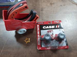 lot 43 image: Vintage Roy Rogers Toy Horse Shoes, Roy Rogers Badge, New Ertl Diecast Case Steiger Tractor