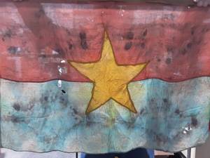 lot 54 image: Vietnamese Captured War Flag 32x21