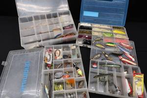 4 FISHING ORGANIZERS WITH ALL SORTS OF GOODIES.