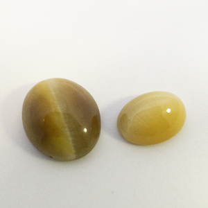 2 CATS EYE - 2.89 tw. ct. Oval cabochon cut