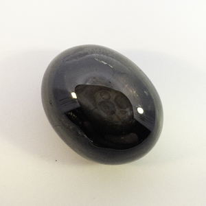 STAR SAPPHIRE - 26.3ct. Black Oval cabochon cut