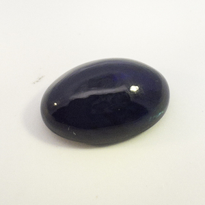 LAB GROWN BLACK OPAL - 3.3ct. Oval cabochon cut