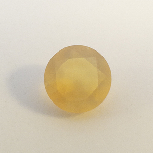 FIRE OPAL - 0.65ct. Round brilliant cut
