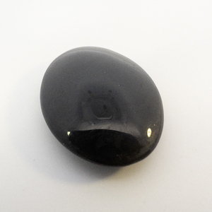 BLACK ONYX - 10.18ct. Oval cabochon cut