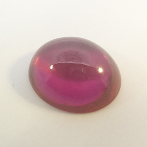 LAB GROWN RUBY - 6.13ct. Oval cabochon cut