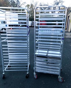 lot 5 image: Pair of Rolling Commercial Baking Racks wMany Unused Trays