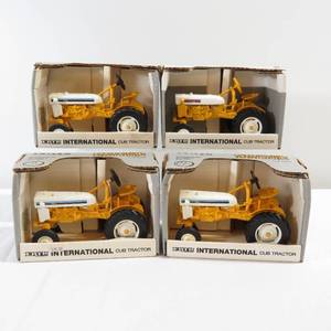 lot 19 image: Lot of 4 Ertl International Cub Tractors 116 Scale w Boxes 1991