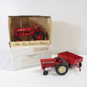 lot 31 image: Lot of 2 Tractors Farmall Toy Tractor Times and International with Cart