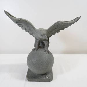 lot 64 image: Carved Stone Eagle on a Globe Sculpture