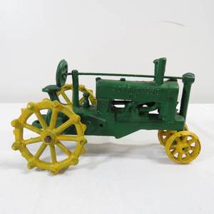 lot 151 image: Collectible Cast Iron John Deere OP Tractor Yellow Wheels