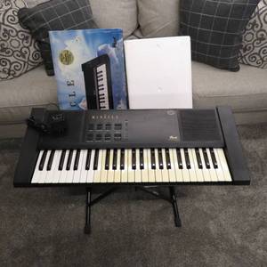lot 174 image: The Miracle Piano Teaching System Keyboard, Power Source, Box and Stand