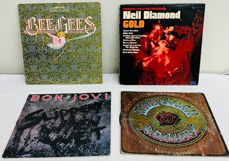 lot 94C image: Four Vintage Record Albums including The BeeGees Main Course, Bon Jovi Slippery When Wet and More