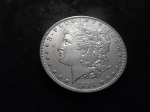 lot 10 image: 1884 O Morgan Silver Dollar