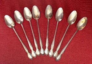 lot 75 image: Eight WM Rogers Sterling Silver Ice Tea Spoons