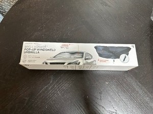 lot 120 image: New Sharper Image Brella Shade Pop up Windshield Umbrella to Protect Car Interior or Good Useless Gift  )