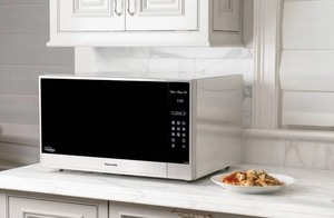 lot 36 image: Panasonic Family Size 2.2CuFt Countertop Microwave Oven with Cyclonic Inverter Technology NN-SN97HS