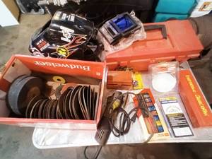 lot 99 image: Grinder and grinding wheels. Welding hood and more