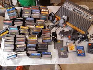 lot 82 image: Atari game console and 100 games