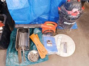 lot 85 image: Garden stakes, chainsaw chains and files, tarp, leaf blower and more