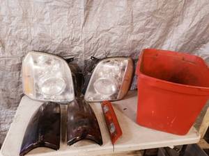 lot 34 image: Tahoe headlights and Silverado taillights