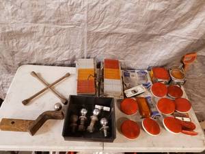 lot 36 image: large assortment of trailer lights and receiver hitch with balls