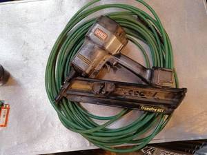 lot 57 image: Senco frame pro 601 framing Nailer and air hose