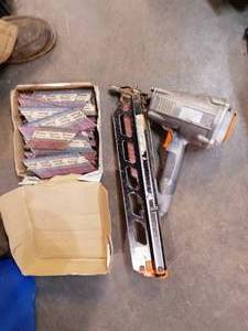 lot 58 image: passload framing nailer with partial box of nails