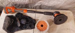 lot 11 image: Black and decker power scrubber includes battery, charger, extra brush and storage bag