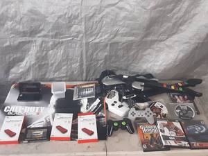 lot 105 image: PlayStation remotes, games, controller converters, Nintendo 3DS