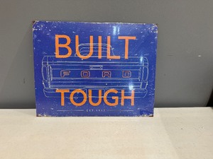lot 83 image: Built Ford Tough Tin Sign