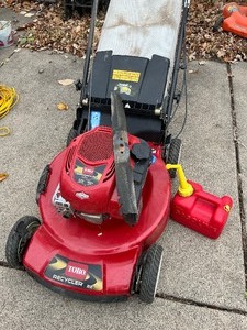 lot 147 image: Toro Lawn Mower plus Gas Can
