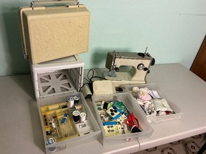lot 229 image: Sears Kenmore Sewing Machine with small Cabinet with Misc. Sewing Items