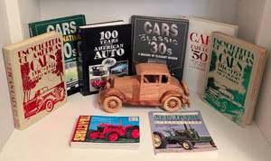 lot 111 image: Variety of Vintage Car Books and Carved Wood Car