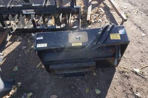 lot 33 image: Toro Brand Mini Skid Loader Mount 42 Garden Tiller