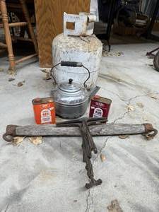 lot 56 image: Vintage Smokeless Powder cans, Coffee Pot, Propane Tank and Metal tool