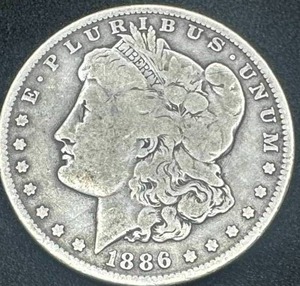 lot 5 image: 1886-O Morgan Silver Dollar (rarer mint)