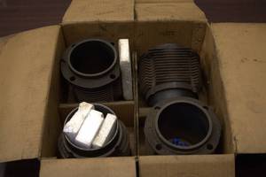 Box of 4 Vintage Motorcycle Engine Cylinders and Parts