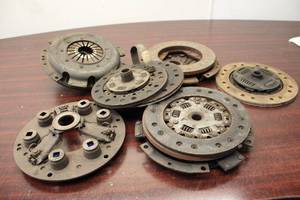Collection of 7 Used Clutch Discs and Pressure Plates for Heavy Machinery