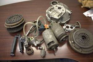 Collection of Used Automotive Parts Including Clutch Assembly and Fuel Pump