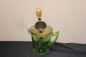 lot 8 image: Vintage Green Uranium Glass Measuring Cup with Hand Mixer Attachment
