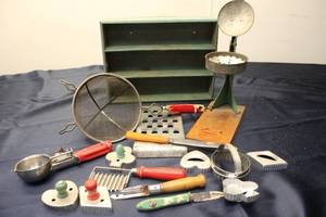 lot 58 image: Vintage Kitchen Tool Collection with Grater, Scoops, and Cookie Cutters