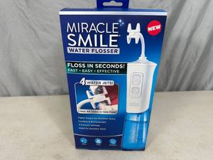 lot 231 image: New Miracle Smile Water Flosser
