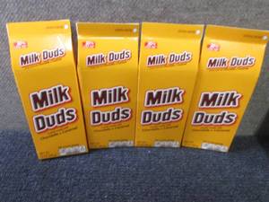 4- 10 oz Milk Duds...