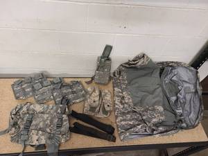 lot 2 image: ACU Bivey Cover (no holes - excellent condition), ACU drop leg holster, 1 Blackhawk S.T.R.I.K.E Gen IV double mag pouch (holds 6 mags), 3 Triple Mag pouches, 2 Waist Packs (excellent condition) and 2 M4 Carbine Black Weapon Slings