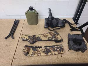 lot 7 image: Center counsel gun rack canteen 2 decoy weights shotgun camo cover and bipod