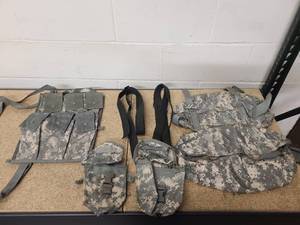 lot 8 image: 2 USGI Individual first aid kit pouch IFAK-ACU Excellent condition 2 ACU mollie waist pack ACU Excellent condition2 USGI M4 Carbine black weapon sling2 USGI 6 mag bandoleer-ACU Excellent condition