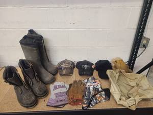 lot 36 image: 2 pairs of boots 3 hats 2 pairs of gloves 1 pair of mittens face mask and a duffle bag